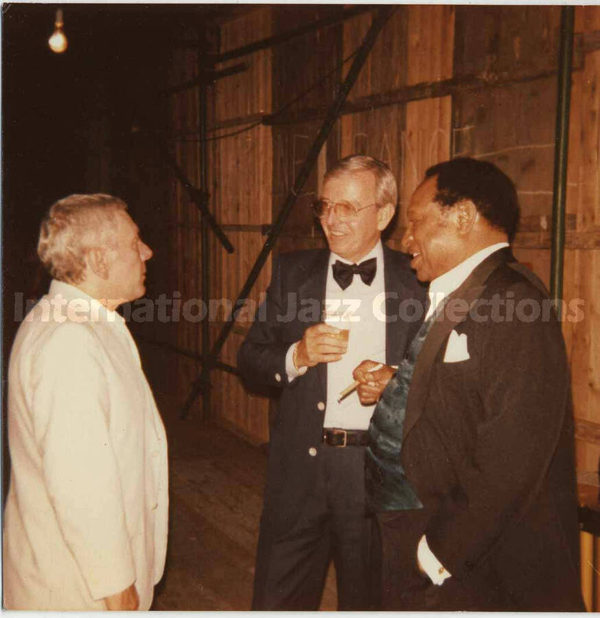 3 1/2 x 3 1/2 inch photograph. Lionel Hampton with unidentified men