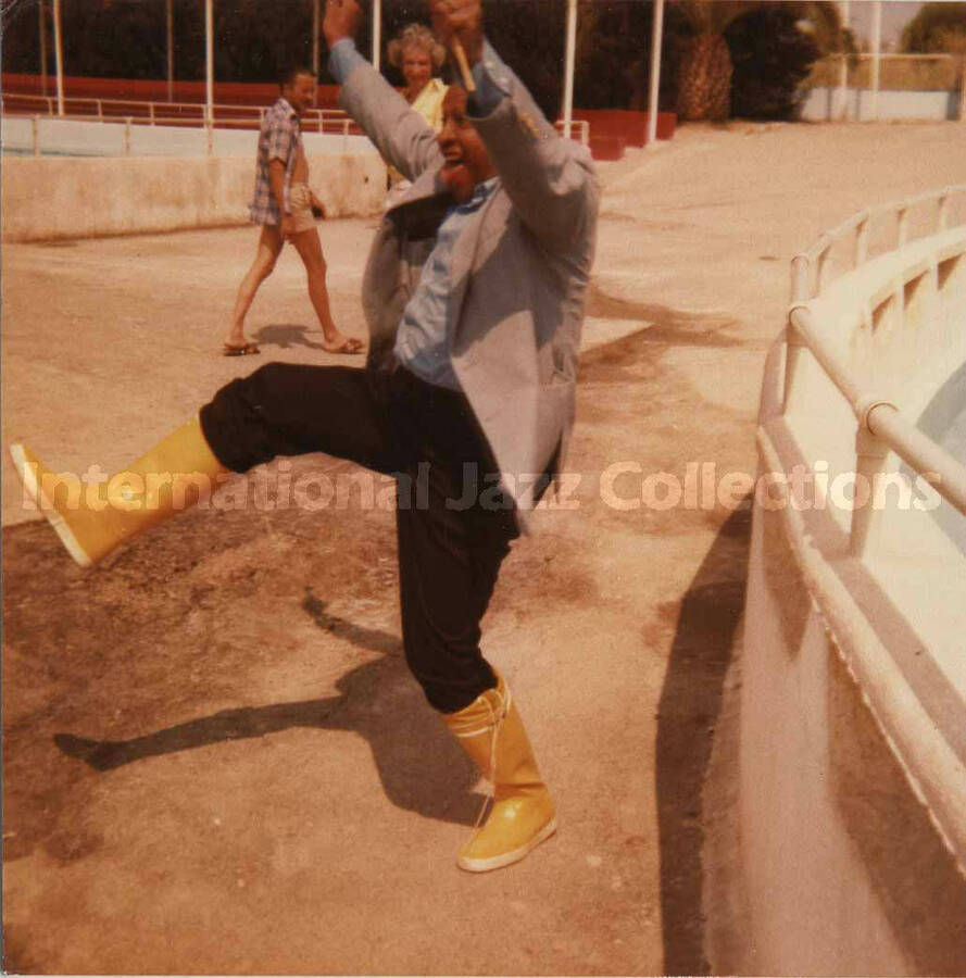 3 1/2 x 3 1/2 inch photograph. Lionel Hampton cheers at a marine mammal park