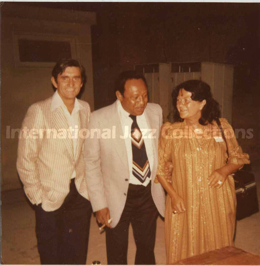 3 1/2 x 3 1/2 inch photograph. Lionel Hampton with unidentified man and woman