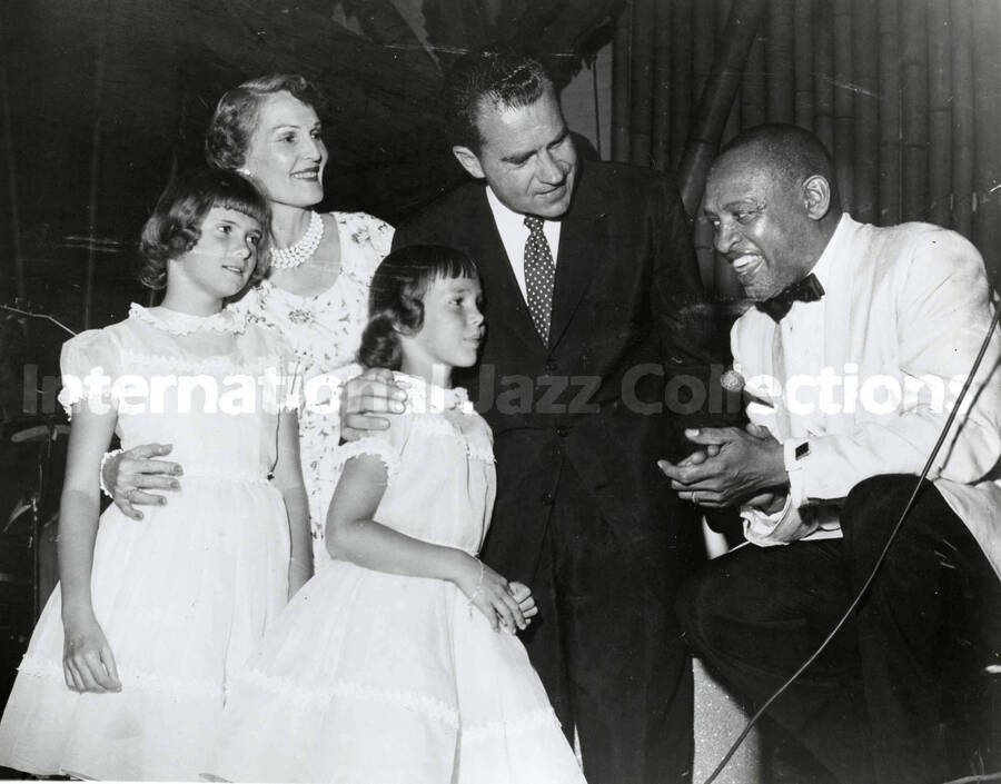 8 x 10 inch photograph. Lionel Hampton with Richard Nixon, Thelma Catherine Ryan, and their daughters, Tricia and Julie
