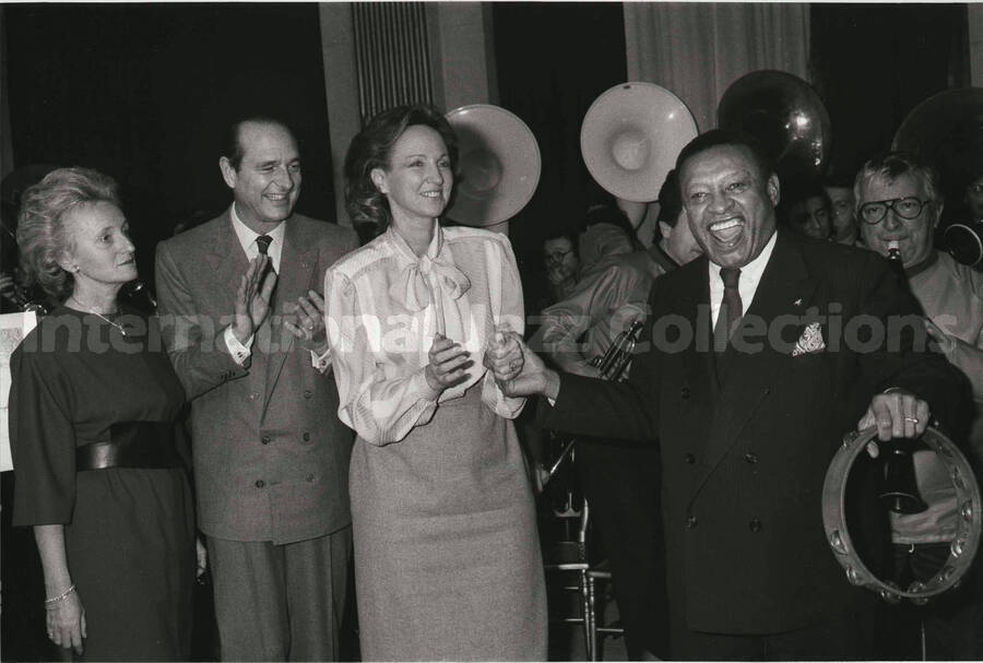 6 1/2 x 9 1/2 inch photograph.  Lionel Hampton with Jacques Chirac and unidentified persons on the occasion of his receiving the medal of the City of Paris