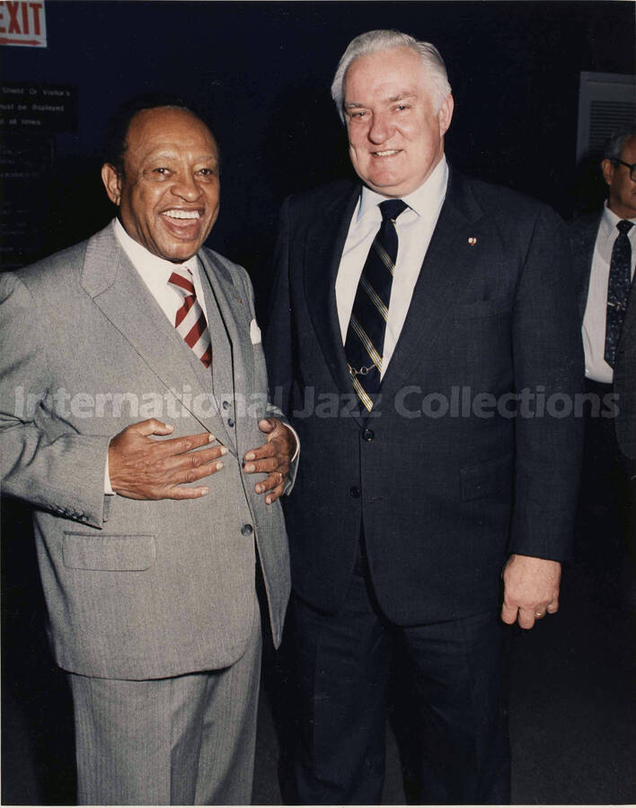 10 x 8 inch photograph. Lionel Hampton with unidentified man during his visit to the New York City Police Department