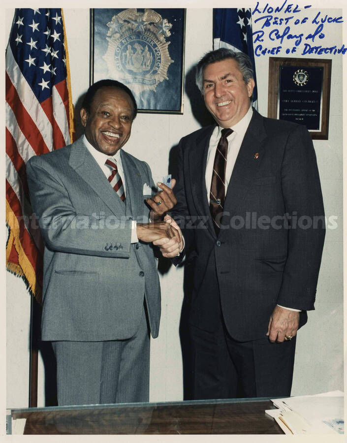 10 x 8 inch signed photograph. Lionel Hampton with chief of detectives, Robert Colangelo, during his visit to the New York City Police Department