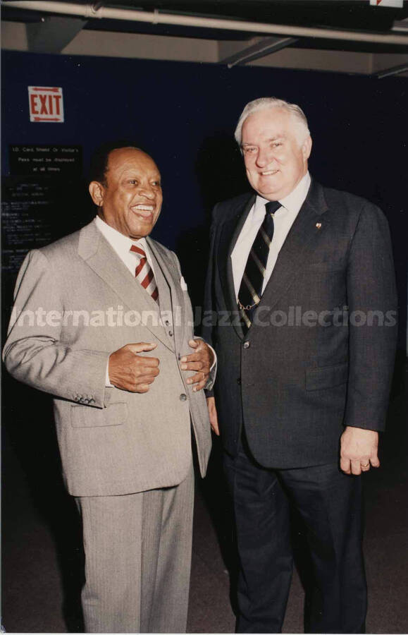 7 x 5 photograph. Lionel Hampton with unidentified man during his visit to the New York City Police Department