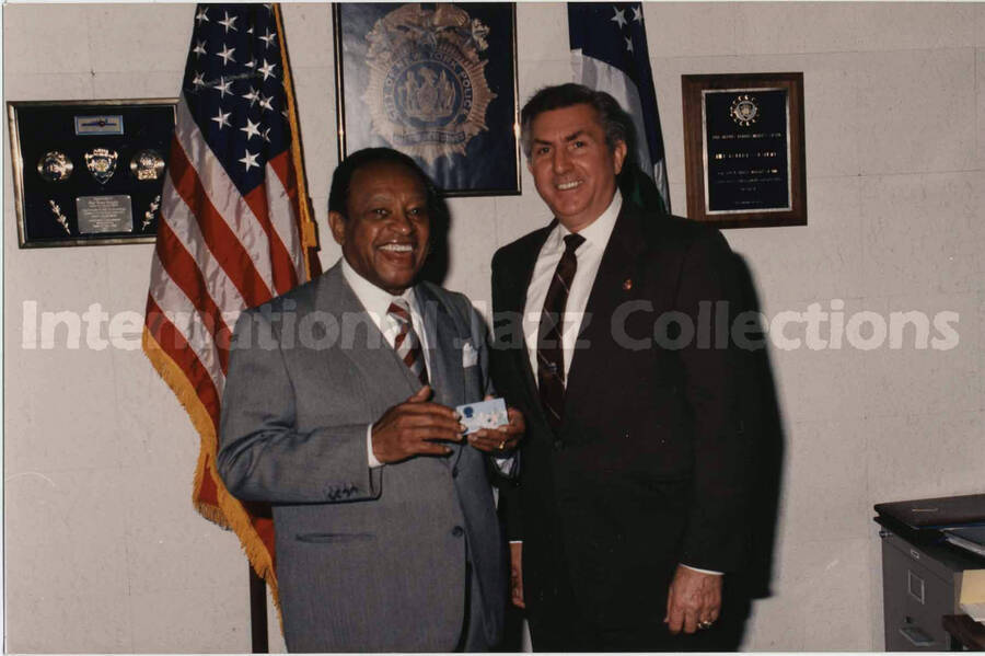5 x 7 inch photograph. Lionel Hampton with chief of detectives, Robert Colangelo, during his visit to the New York City Police Department