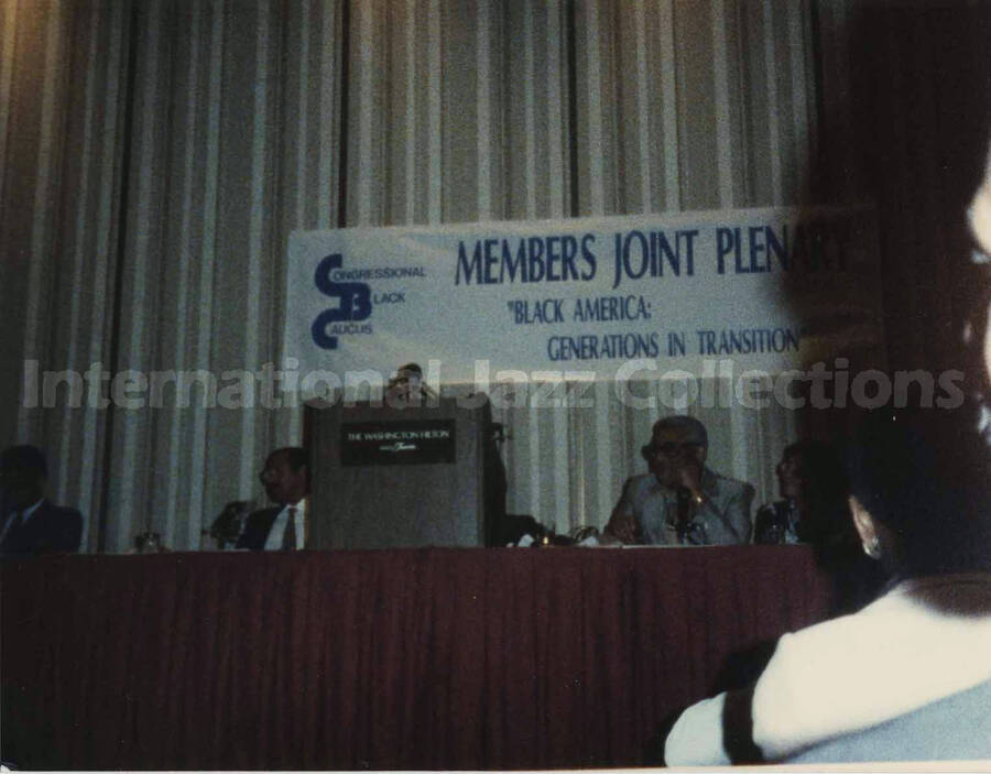 4 x 5 inch photograph. Unidentified members of the plenary of the Congressional Black Caucus entitled: Black America - Generations in Transition, at the Washington Hilton