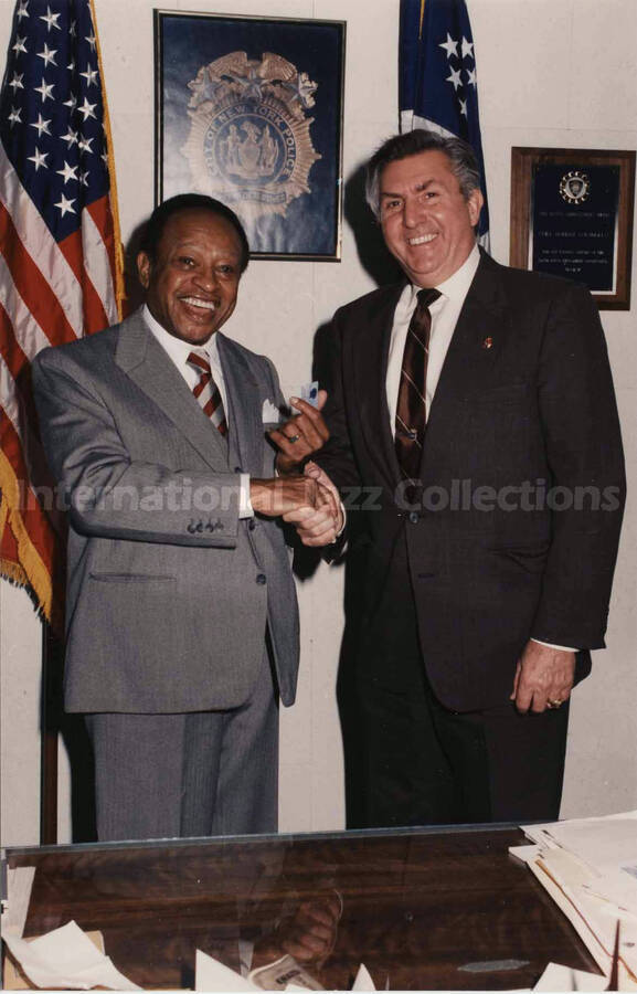 7 x 5 inch photograph. Lionel Hampton with chief of detectives, Robert Colangelo, during his visit to the New York City Police Department