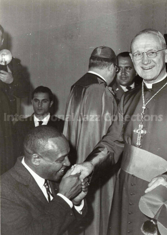 10 x 8 inch photograph. Lionel Hampton with unidentified catholic religious man [in Vatican, Rome, Italy?]