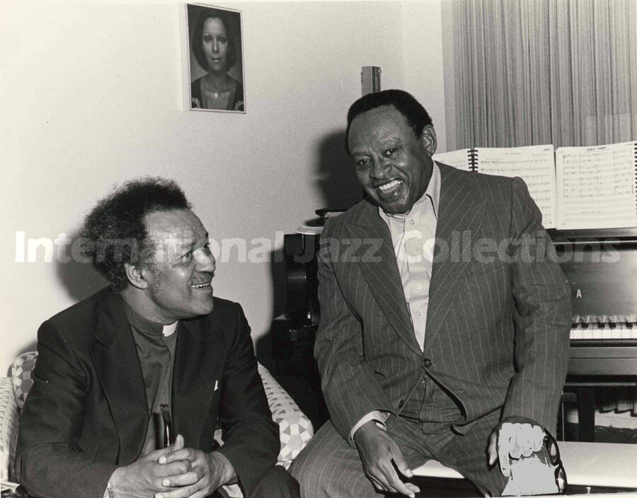 8 x 10 inch photograph. Lionel Hampton with unidentified religious man