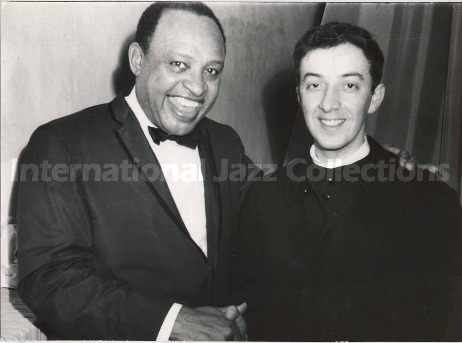 5 x 7 inch photograph. Lionel Hampton with unidentified religious man