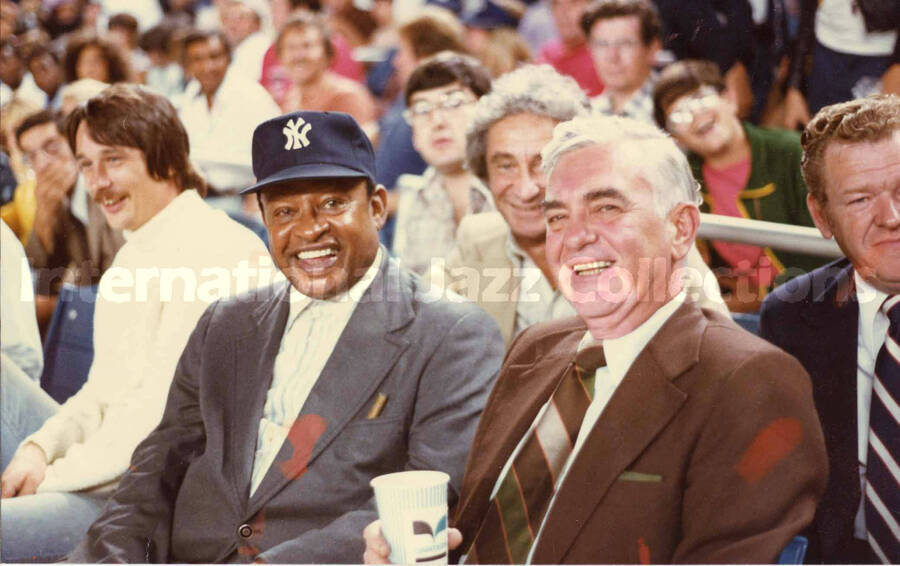 5 x 7 inch photograph. Lionel Hampton with unidentified men at a New York Yankees game