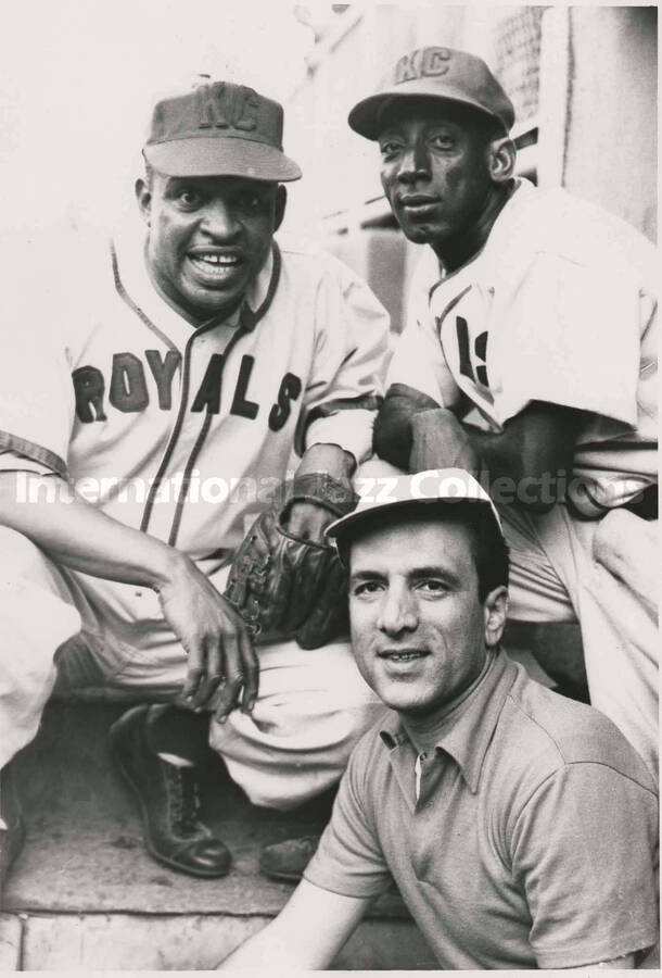 7 x 5 inch photograph. Lionel Hampton in a Kansas City Royals uniform poses with unidentified player and a man