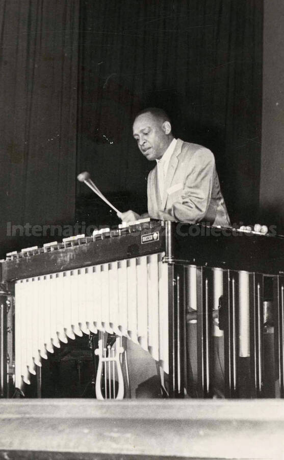 7 x 4 1/2 inch photograph. Lionel Hampton playing the vibraphone