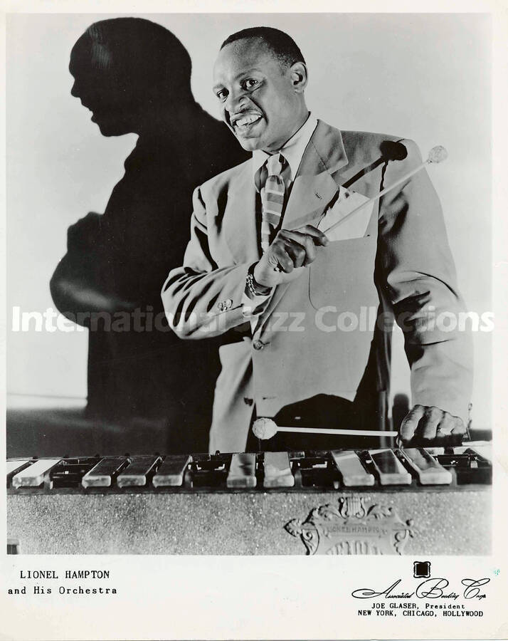 10 x 8 inch promotional photograph. Lionel Hampton at the vibraphone. Inscribed at the bottom of the photograph: Lionel Hampton and His Orchestra