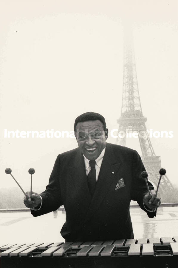 10 x 8 inch photograph. Lionel Hampton posing behind his vibraphone, in Paris