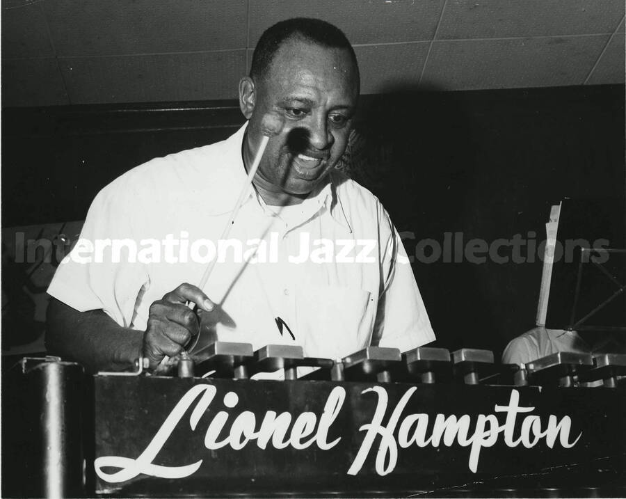 8 x 10 inch photograph. Lionel Hampton playing the vibraphone [at an U.S. Air Force base abroad?]