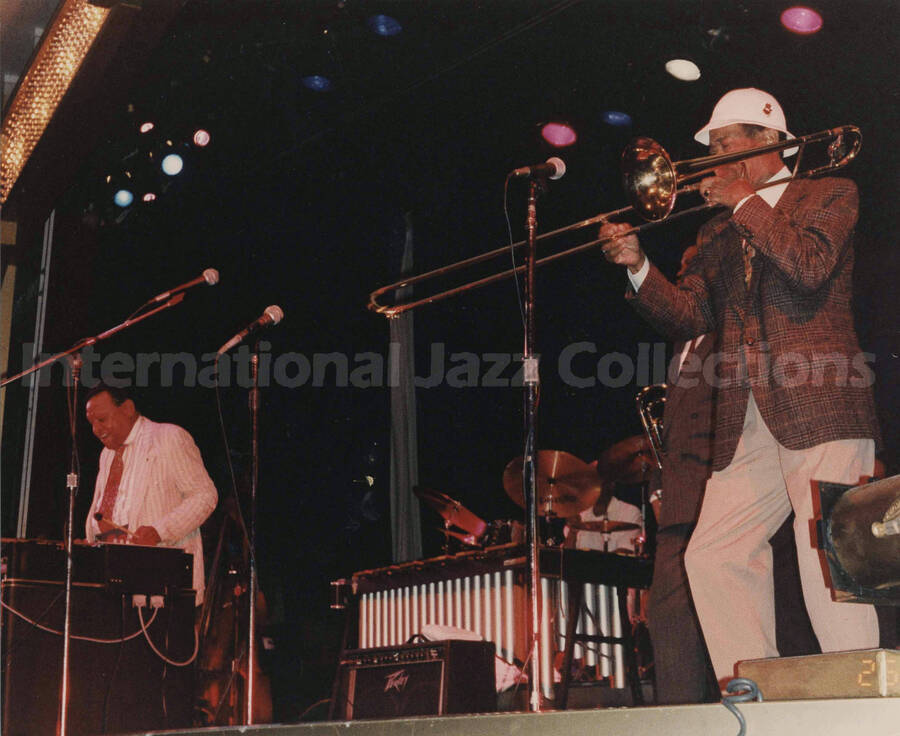 8 x 10 inch photograph. Lionel Hampton performing on the vibraphone with Al Grey on the trombone