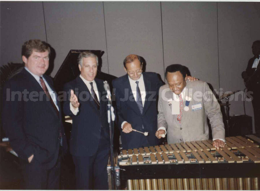 3 1/2 x 5 inch photograph. Lionel Hampton at the vibraphone posing with three unidentified men, on the occasion of the Republican National Convention, in New Orleans, LA
