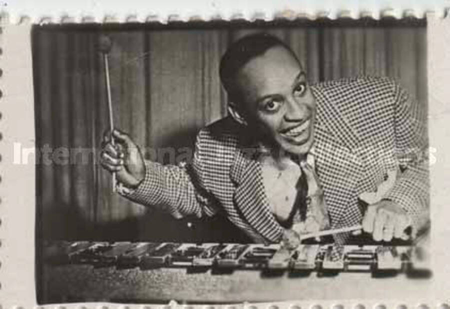 1 x 1 1/2 inch photograph. Lionel Hampton playing the vibraphone