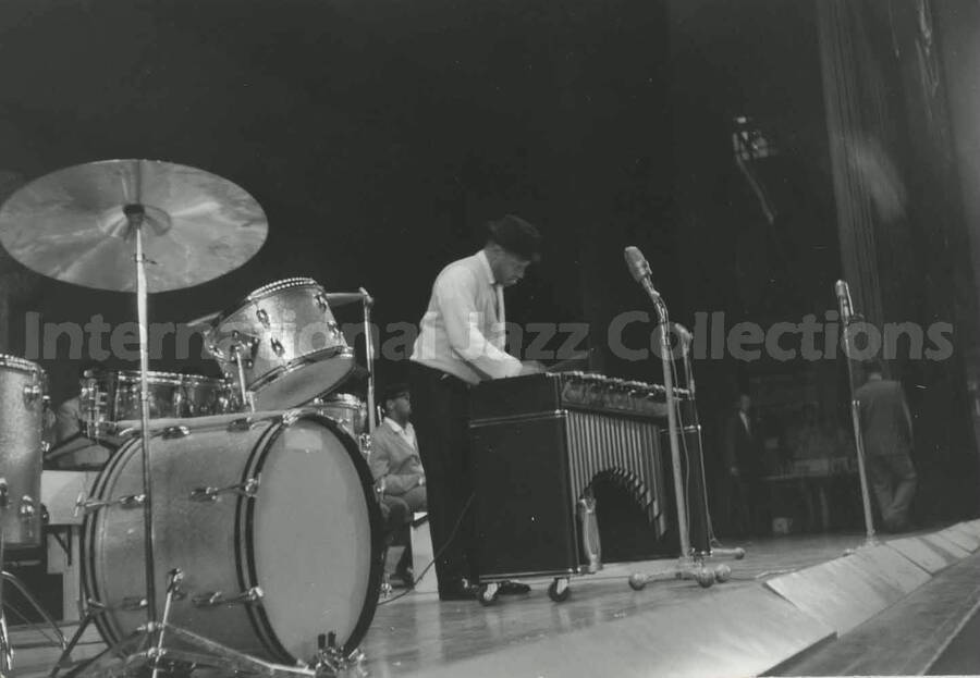 3 1/5 x 5 inch photograph. Lionel Hampton playing the vibraphone with orchestra [in Japan?]