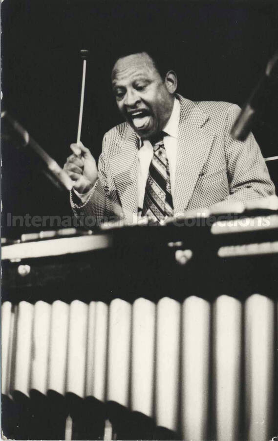 5 1/2 x 3 1/2 inch photograph. Lionel Hampton playing the vibraphone