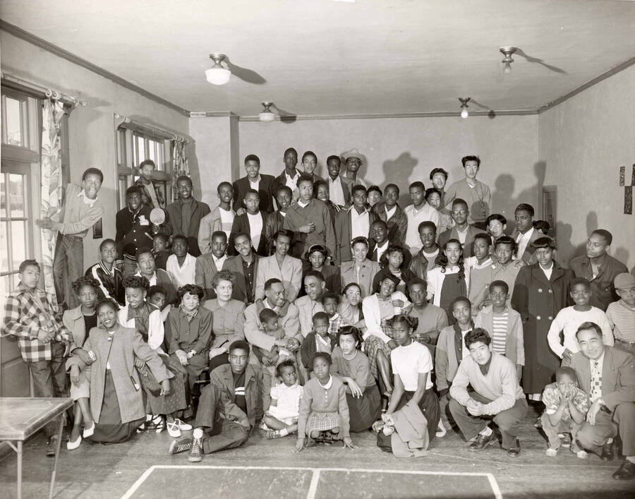 8 x 10 inch photograph. Lionel Hampton with a large group of unidentified people, including children