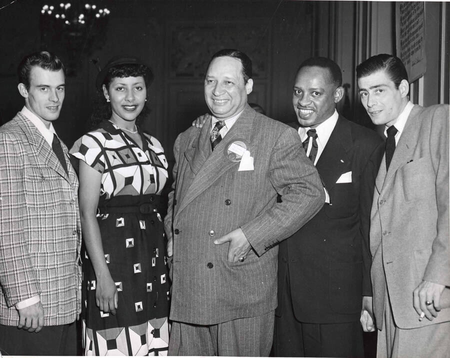 8 x 10 inch photograph. Lionel Hampton with Doug Duke, first on left, and unidentified persons