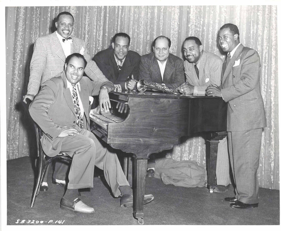 8 x 10 inch photograph. Lionel Hampton,  Louis Armstrong, and four unidentified men