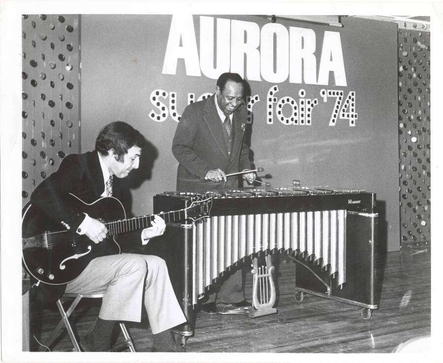 8 x 10 inch photograph. Lionel Hampton on vibraphone with unidentified guitarist at the Aurora Super Fair' 74