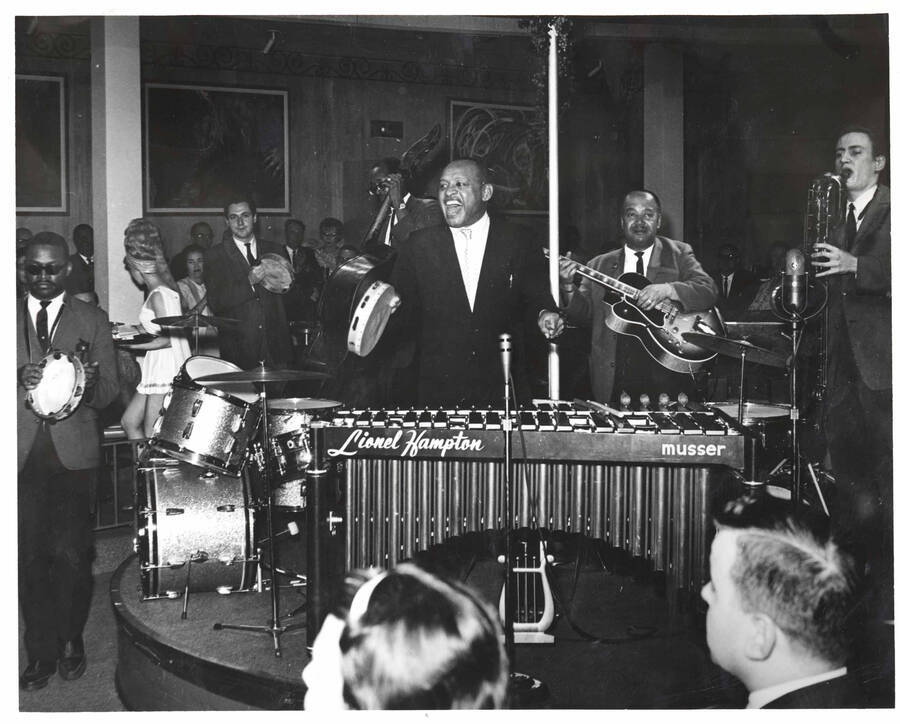8 x 10 inch photograph. Lionel Hampton with band, which includes guitarist Billy Mackel, at a club