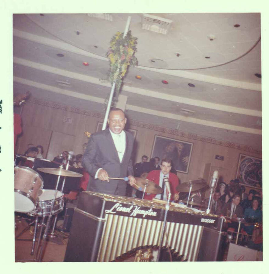 3 1/2 x 3 1/2 inch photograph. Lionel Hampton on vibraphone with band [at Al Hirt's New Orleans Bourbon street nightclub]