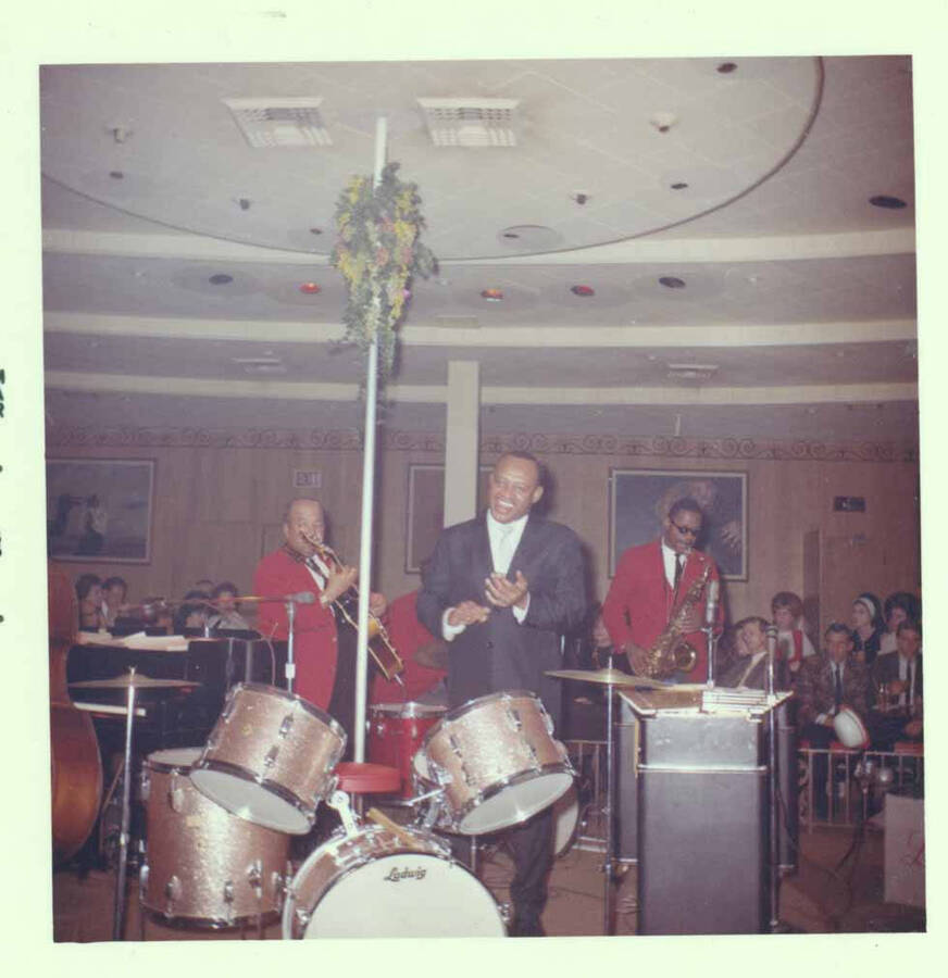 3 1/2 x 3 1/2 inch photograph. Lionel Hampton with band at Al Hirt's New Orleans Bourbon street nightclub]