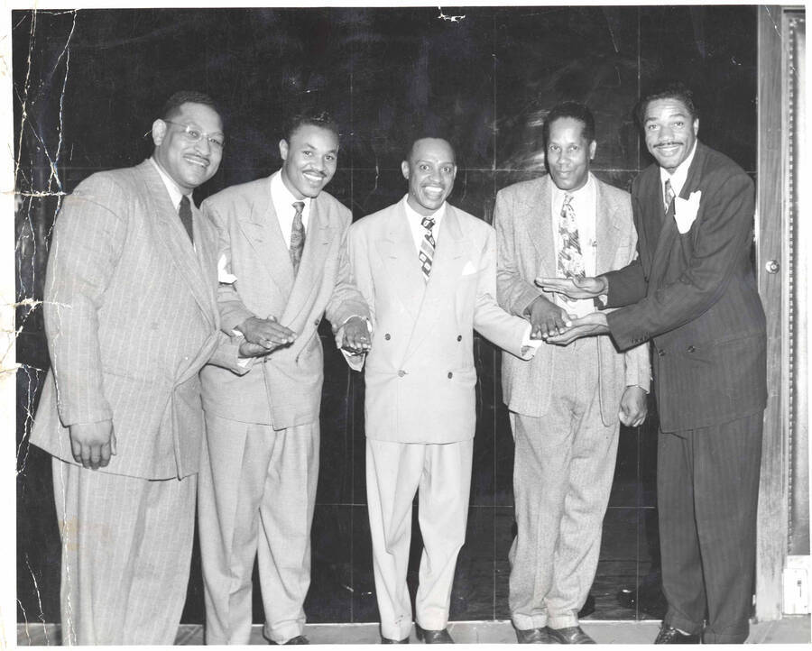 8 x 10 inch photograph. Lionel Hampton with Slim Gaillard and unidentified men