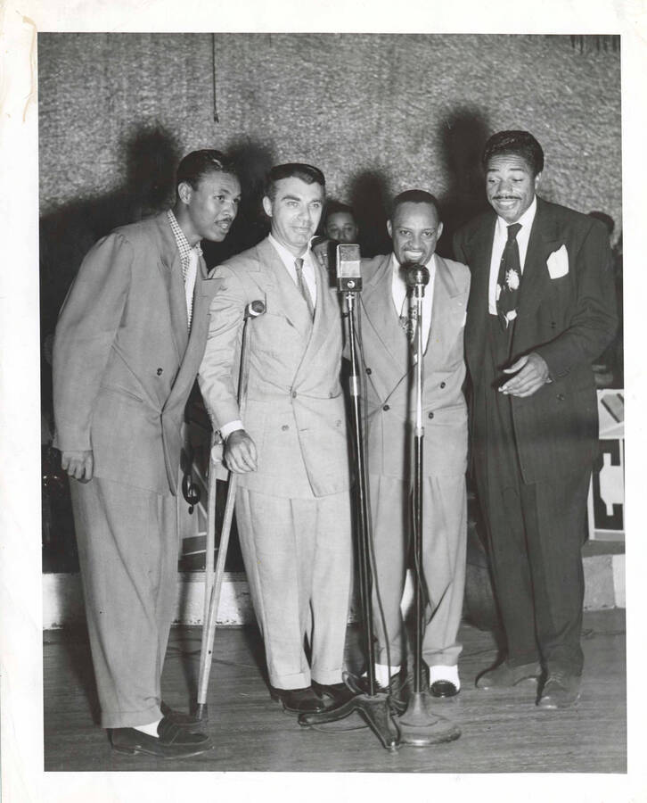 10 x 8 inch photograph. Lionel Hampton with Slim Gaillard and unidentified men