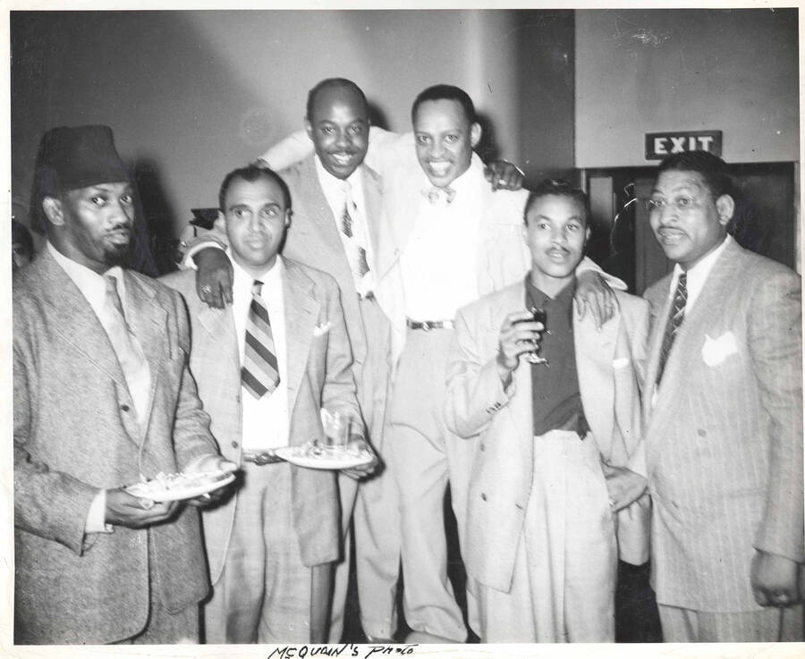 8 x 10 inch photograph. Lionel Hampton with Roy Milton and unidentified men