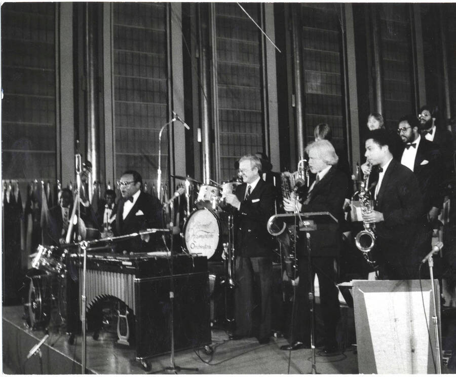 8 x 10 inch photograph. Lionel Hampton with orchestra, on the occasion of his receiving a plaque from the United States Mission that appointed him as Ambassador of Music to the United Nations
