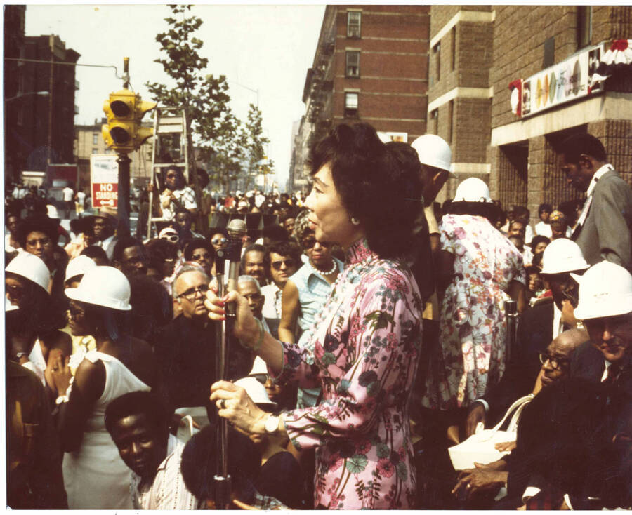 8 x 10 inch photograph. Unidentified woman speaks at the Grand Opening of Lionel Hampton Houses