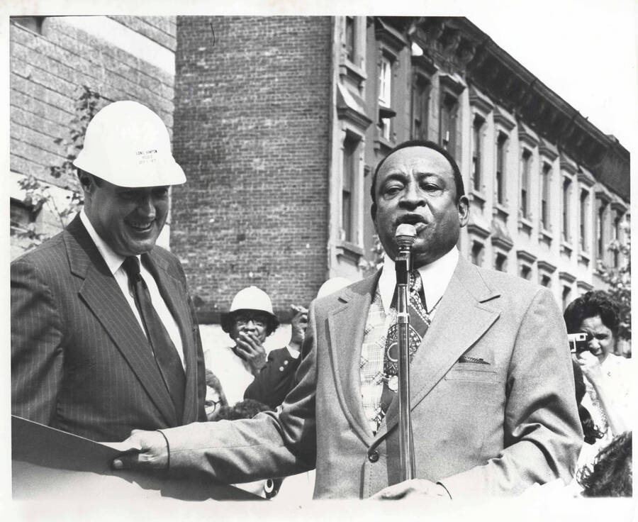 8 x 10 inch photograph. Lionel Hampton with unidentified man at the Grand Opening of Lionel Hampton Houses