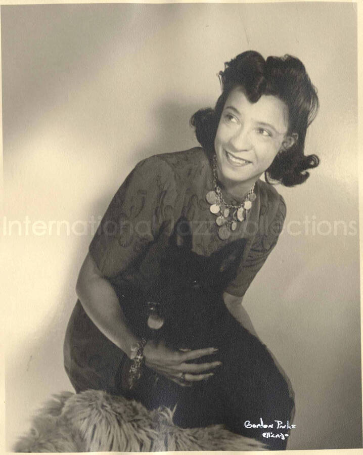 10 x 8 inch photograph. Portrait of Gladys Hampton with a black scottie dog