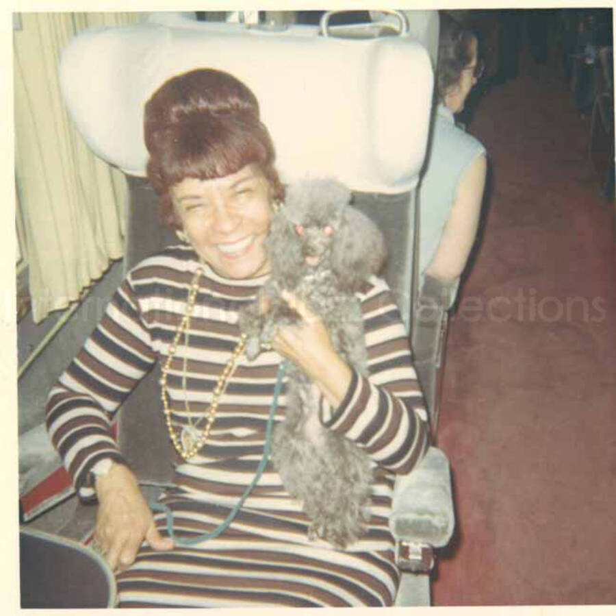 Gladys Hampton with a dog. 3 1/2 x 3 1/2 inch photograph.