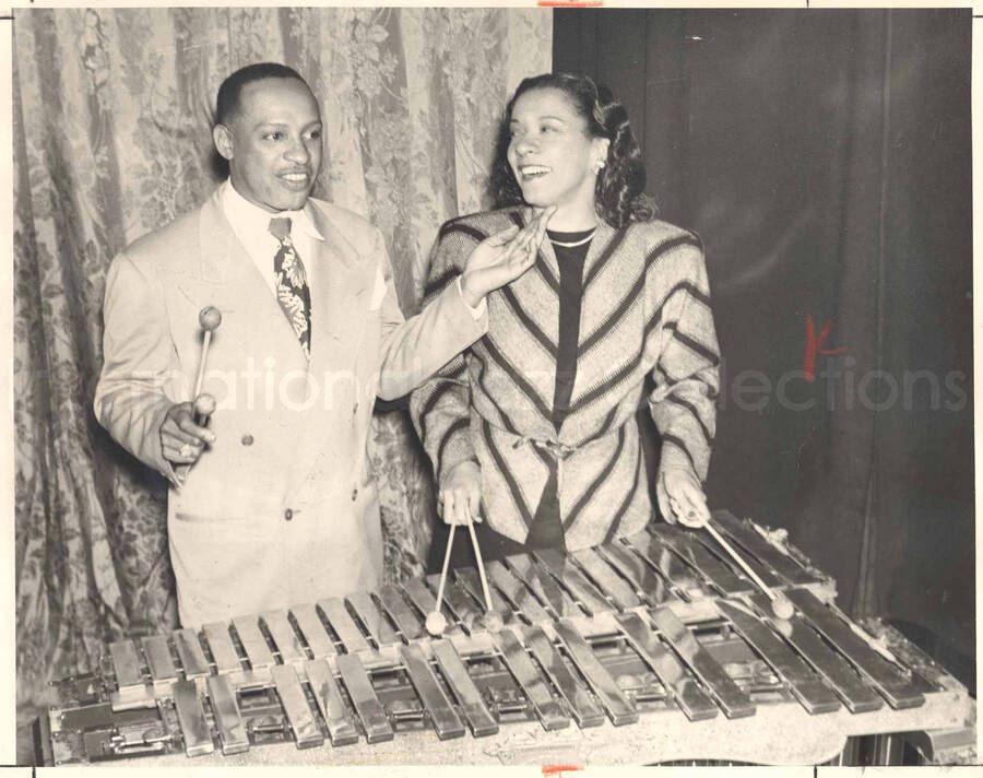 8 x 10 inch photograph. Lionel and Gladys Hampton. A caption on the back of the photograph reads: God gave me the talent... but my beloved Gladys gave me the inspiration