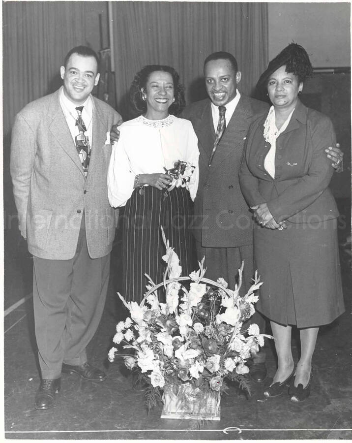 10 x 8 inch photograph. Lionel and Gladys Hampton with unidentified man and woman