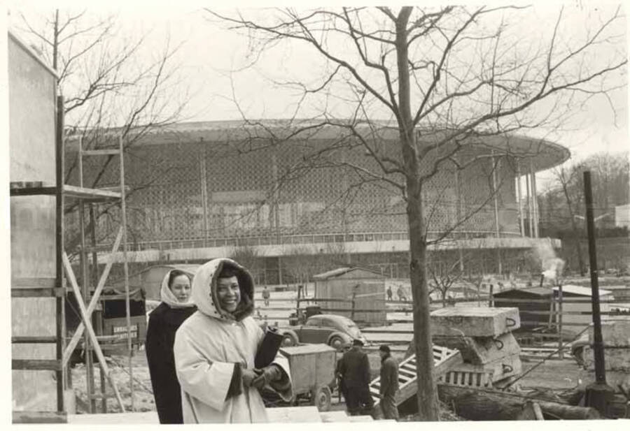 3 x 4 inch photograph. Gladys Hampton at the Brussels Worlds Fair in front of the United States Pavilion