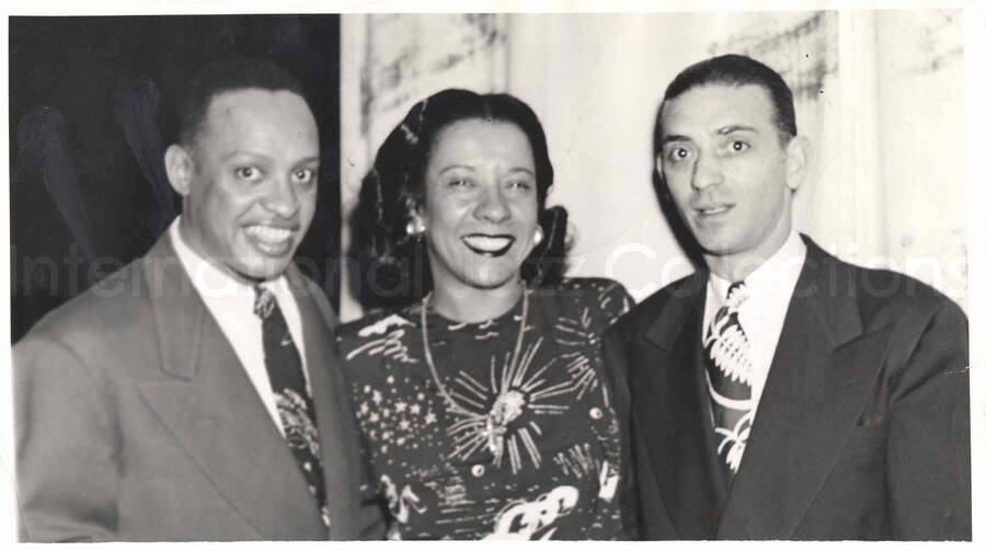 5 1/2 x 10 inch photograph. Lionel and Gladys Hampton with unidentified man