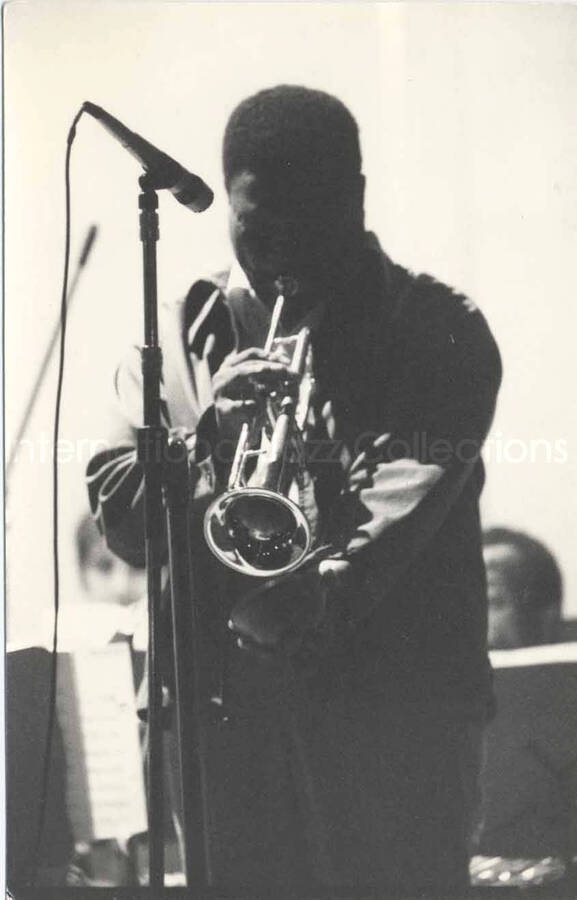 6 1/2 x 4 1/4 inch photograph. Lionel Hampton's band. Unidentified trumpeter