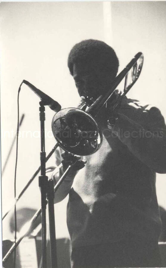 6 1/2 x 4 1/4 inch photograph. Lionel Hampton's band. Unidentified trombonist