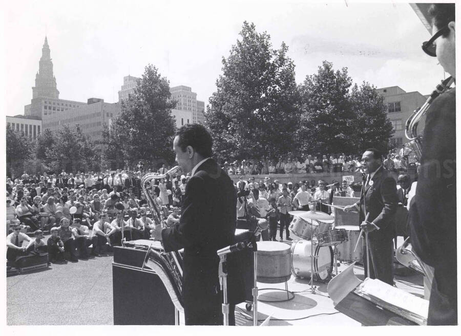 8 x 10 inch photograph. Lionel Hampton at an outdoor concert. A poster on the background reads: Fun Day