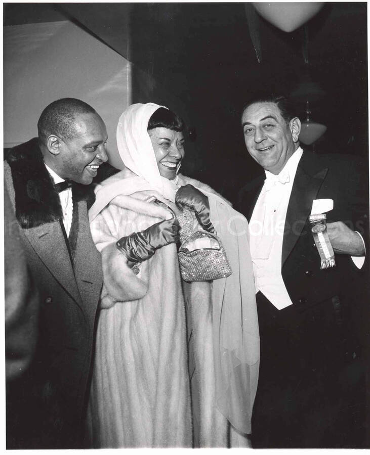10 x 8 inch photograph. Lionel and Gladys Hampton with Guy Lombardo. They are wearing medals of the Inaugural Committee of President Dwight D. Eisenhower