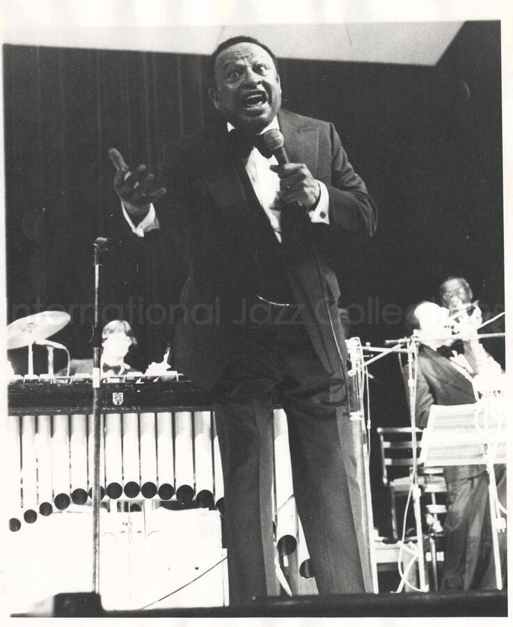 10 x 8 inch photograph. Lionel Hampton on stage [on the occasion of his receiving a medal]