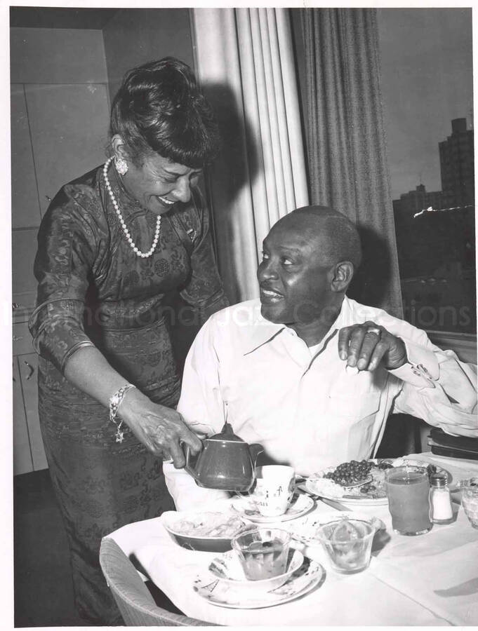 9 x 7 inch photograph. Gladys and Lionel Hampton having breakfast [abroad?]